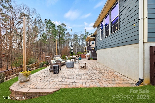view of patio / terrace with stairway and an outdoor hangout area