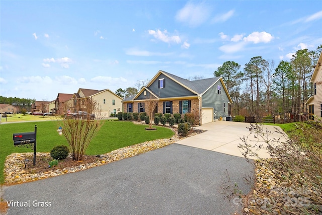 view of front of home featuring brick siding, a front lawn, driveway, and an attached garage