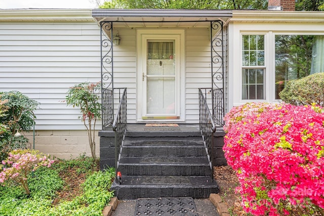 doorway to property featuring a chimney
