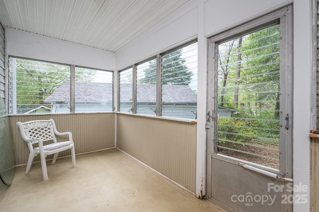 sunroom / solarium featuring a healthy amount of sunlight