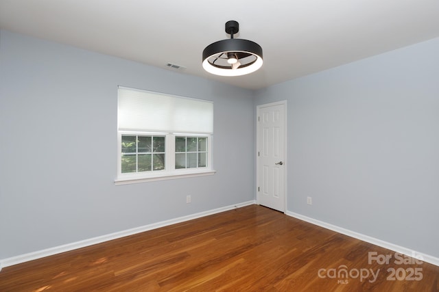 1455 Fieldcrest Cir, Rock Hill, SC 29732 - unfurnished room featuring baseboards, wood finished floors, and visible vents