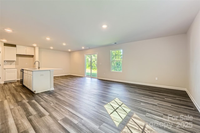 2107 Columbidae Ln, Gastonia, NC 28052 - unfurnished living room with dark wood-style floors and recessed lighting