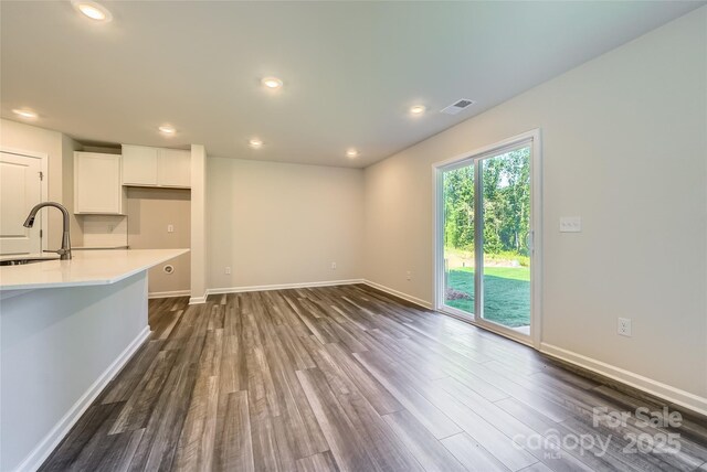 2107 Columbidae Ln, Gastonia, NC 28052 - unfurnished living room with dark wood finished floors and recessed lighting