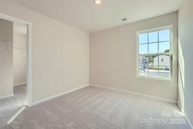 2107 Columbidae Ln, Gastonia, NC 28052 - unfurnished bedroom with carpet, a walk in closet, a closet, and recessed lighting