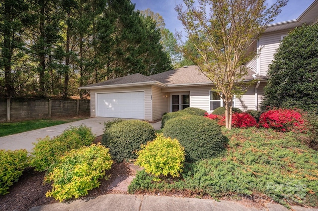 206 Carrington Pl, Arden, NC 28704 - view of front of house with fence, concrete driveway, and a garage