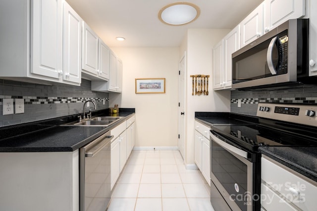 206 Carrington Pl, Arden, NC 28704 - kitchen featuring white cabinetry, stainless steel appliances, and a sink