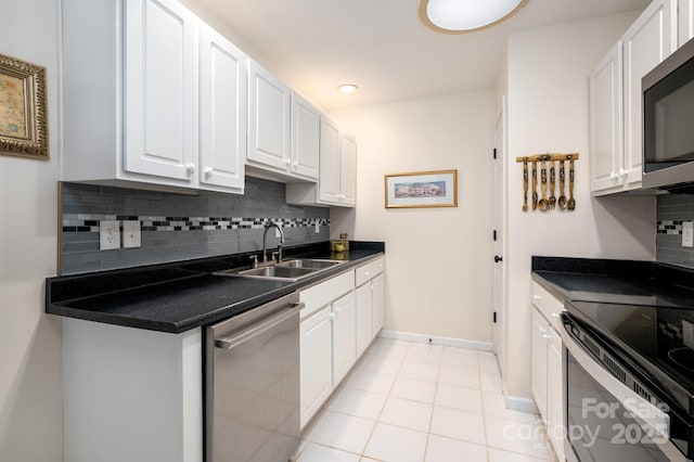 206 Carrington Pl, Arden, NC 28704 - kitchen with white cabinetry, appliances with stainless steel finishes, and a sink