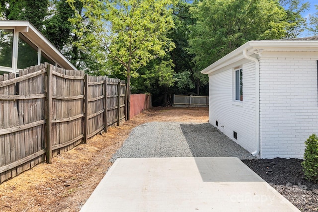 view of yard with a patio and fence