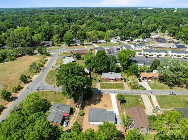 aerial view featuring a wooded view
