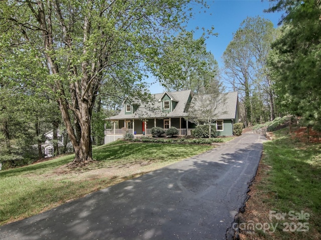view of front of home with a front lawn and covered porch