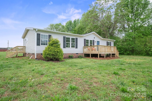 back of house with a deck, a yard, and crawl space