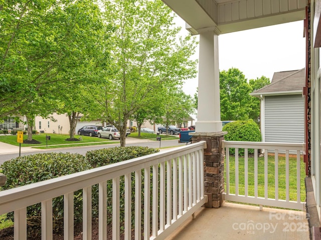 balcony featuring a porch and a residential view