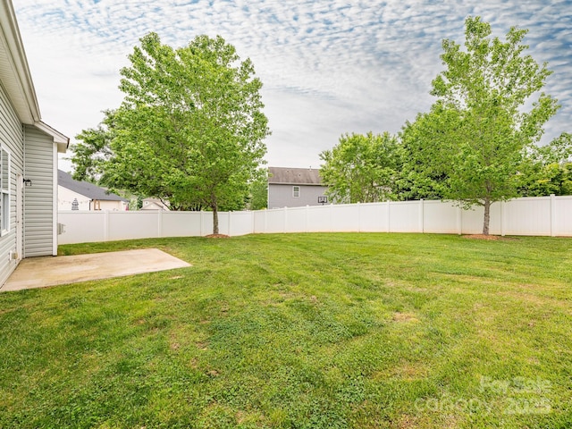 view of yard with fence and a patio area