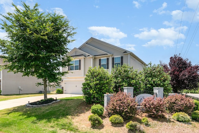 2739 Golden Rose Ln, Charlotte, NC 28216 - view of front of home featuring driveway, an attached garage, and a front lawn