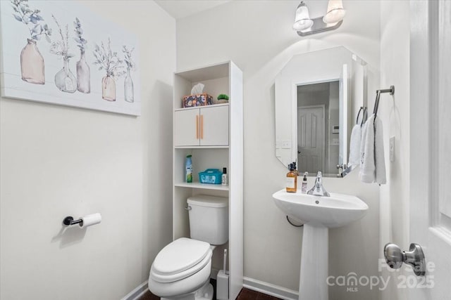 2739 Golden Rose Ln, Charlotte, NC 28216 - half bathroom featuring toilet and baseboards