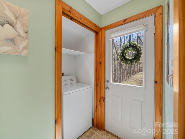 laundry area featuring washer / dryer and laundry area