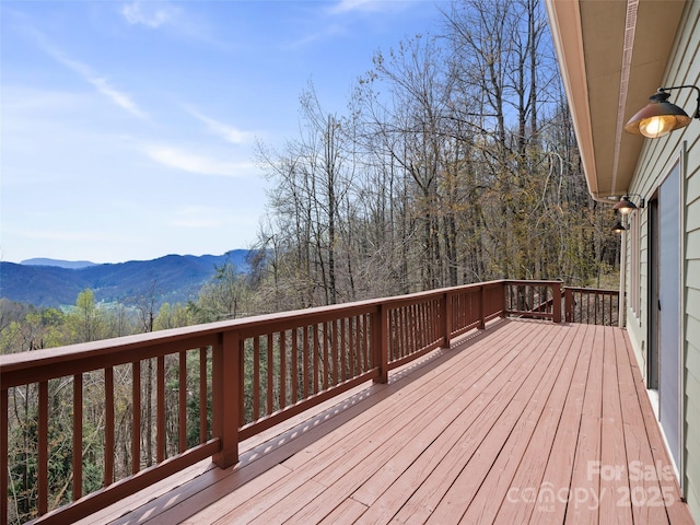 wooden terrace featuring a mountain view
