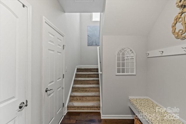 interior space featuring visible vents, baseboards, and wood finished floors