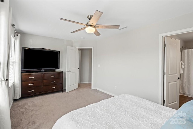 bedroom with baseboards, visible vents, light colored carpet, and ceiling fan