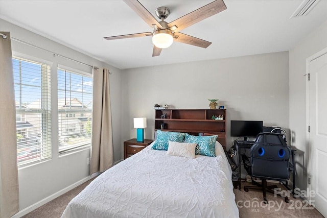 bedroom with ceiling fan, baseboards, visible vents, and carpet