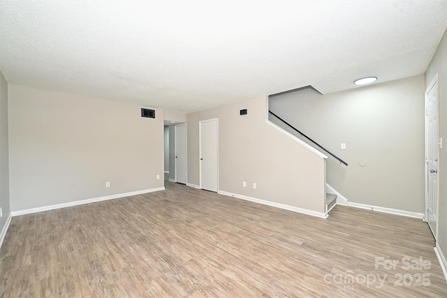 1931 Mereview Ct Unit 46, Charlotte, NC 28210 - unfurnished living room with light wood-style floors and stairs
