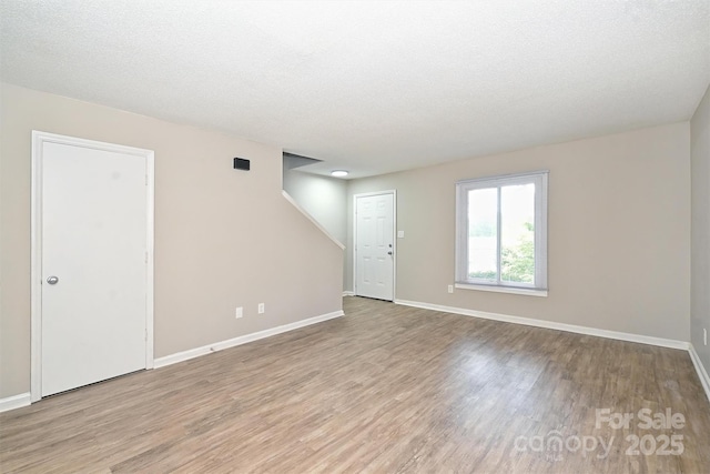1931 Mereview Ct Unit 46, Charlotte, NC 28210 - spare room featuring wood finished floors and a textured ceiling