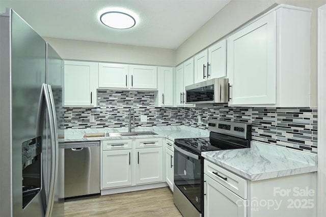 1931 Mereview Ct Unit 46, Charlotte, NC 28210 - kitchen with stainless steel appliances, white cabinets, and tasteful backsplash