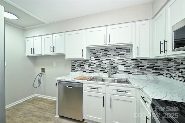 1931 Mereview Ct Unit 46, Charlotte, NC 28210 - kitchen featuring appliances with stainless steel finishes, backsplash, and white cabinetry