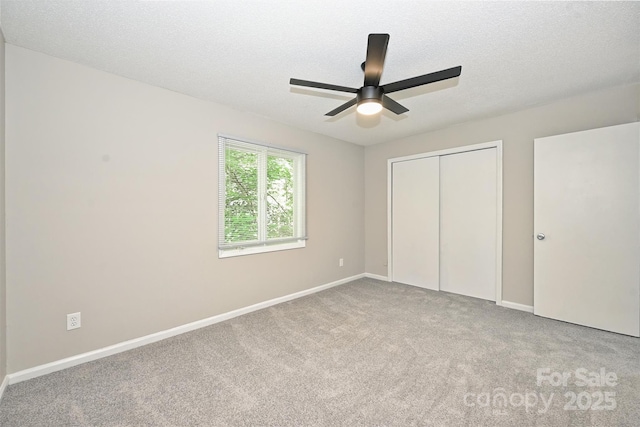 1931 Mereview Ct Unit 46, Charlotte, NC 28210 - unfurnished bedroom with carpet flooring, a closet, a ceiling fan, and a textured ceiling