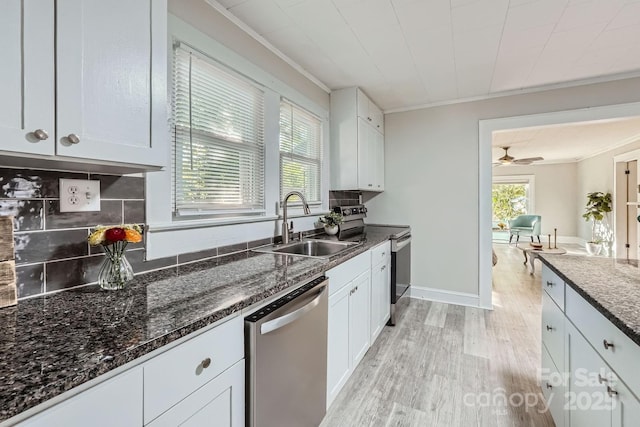 828 Richard Ave, Kannapolis, NC 28081 - kitchen featuring backsplash, crown molding, appliances with stainless steel finishes, and a sink