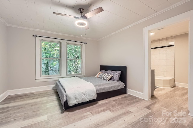 828 Richard Ave, Kannapolis, NC 28081 - bedroom featuring wood finished floors, ensuite bath, baseboards, and ornamental molding
