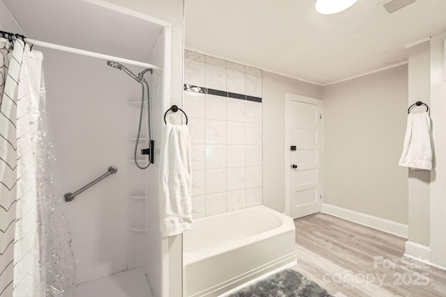 828 Richard Ave, Kannapolis, NC 28081 - full bathroom with wood finished floors, visible vents, baseboards, and ornamental molding