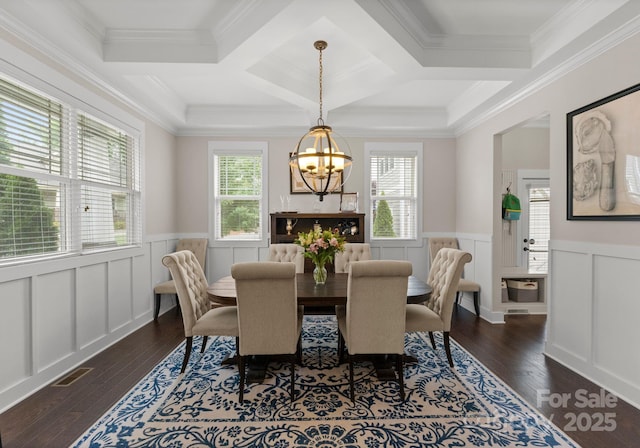 dining room with a chandelier, visible vents, a wainscoted wall, and dark wood-style floors