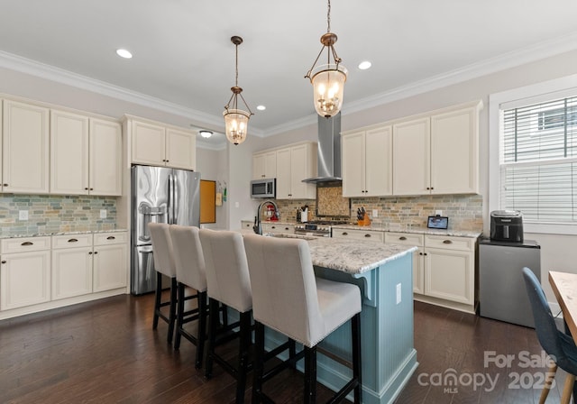 kitchen featuring pendant lighting, tasteful backsplash, stainless steel appliances, dark wood-style flooring, and wall chimney exhaust hood