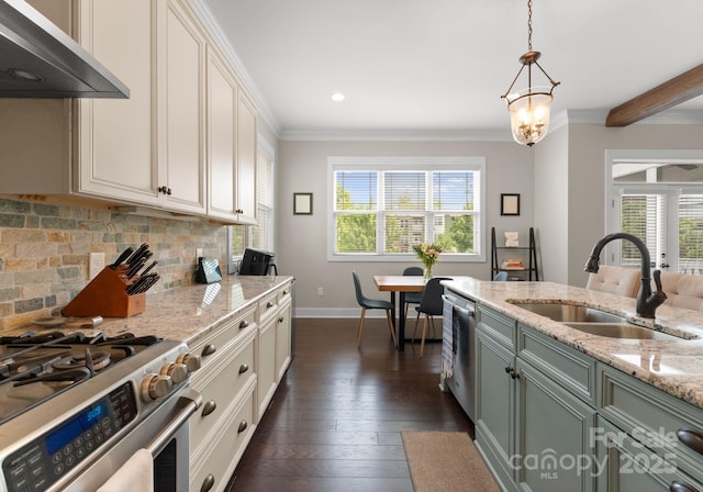 kitchen featuring a sink, under cabinet range hood, tasteful backsplash, crown molding, and appliances with stainless steel finishes