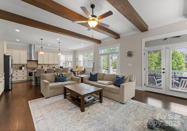 living room featuring dark wood-style flooring, french doors, ceiling fan, and beamed ceiling