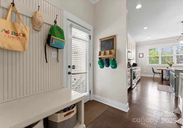 mudroom featuring dark wood-type flooring, crown molding, recessed lighting, and baseboards