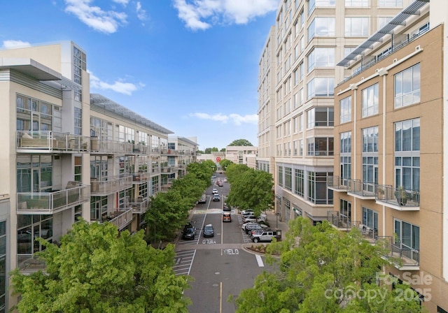 view of community with uncovered parking