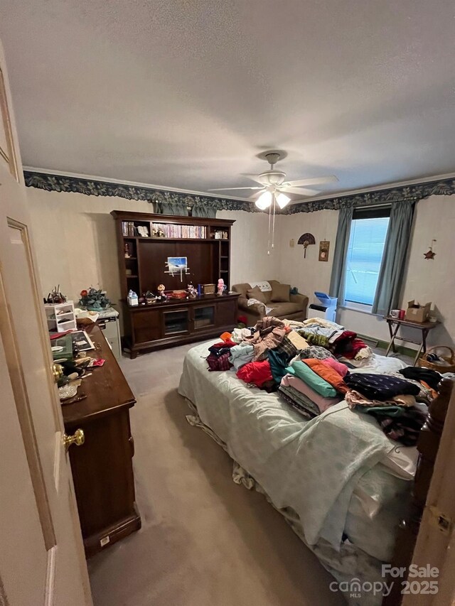 bedroom with a ceiling fan and light colored carpet