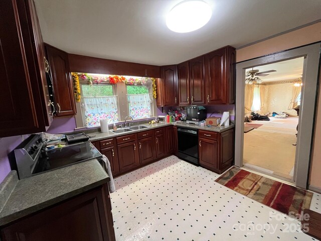 kitchen featuring a ceiling fan, range with electric stovetop, dark countertops, dishwasher, and a sink