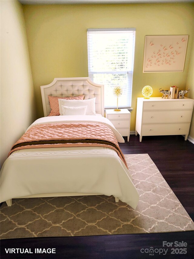 bedroom featuring wood finished floors