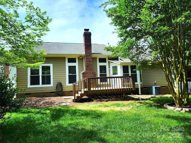 back of house featuring crawl space, a chimney, central air condition unit, a yard, and a wooden deck