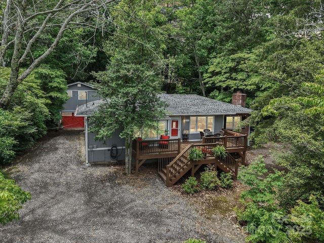 416 S Cherokee Ave, Black Mountain, NC 28711 - view of front of property with a chimney, stairway, a deck, a view of trees, and roof with shingles