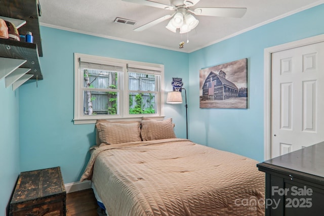 416 S Cherokee Ave, Black Mountain, NC 28711 - bedroom featuring wood finished floors, baseboards, crown molding, and a ceiling fan