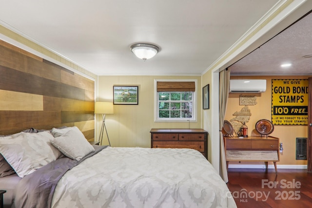 416 S Cherokee Ave, Black Mountain, NC 28711 - bedroom featuring an AC wall unit, wood finished floors, and ornamental molding