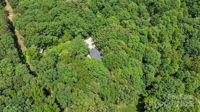 aerial overview of property's location featuring a heavily wooded area