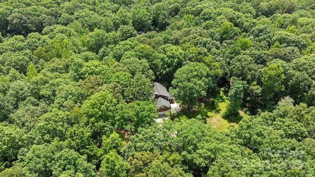 drone / aerial view of a heavily wooded area
