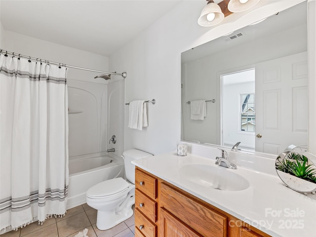 full bathroom with vanity, shower / bath combo with shower curtain, toilet, visible vents, and tile patterned flooring