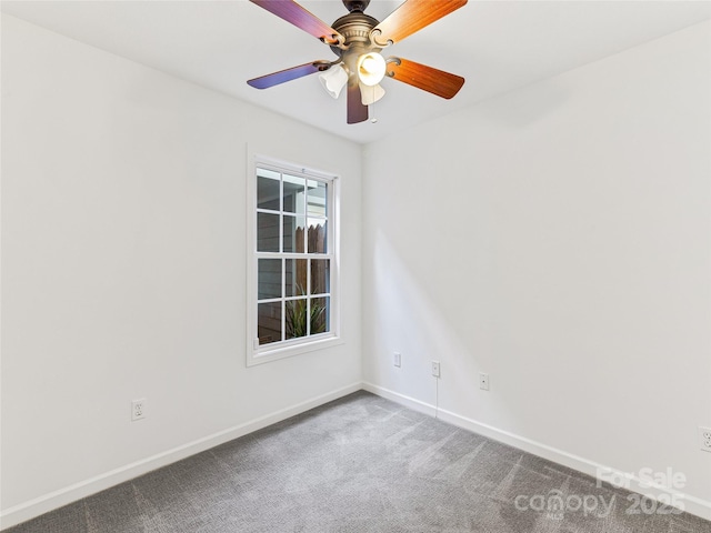 carpeted empty room featuring a ceiling fan and baseboards