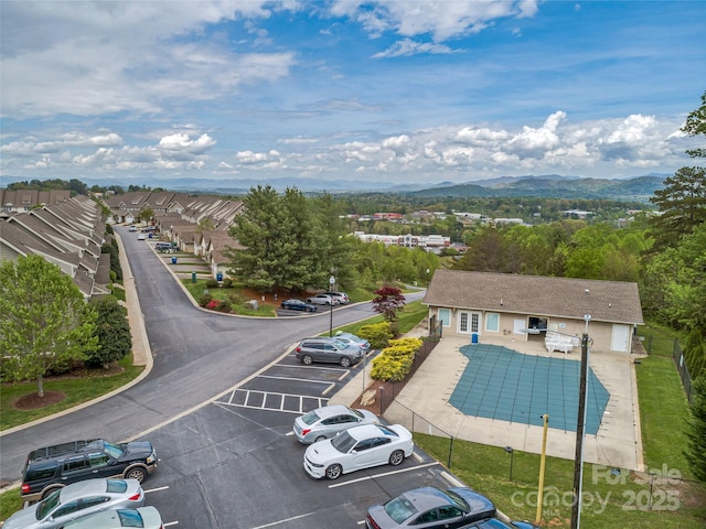 birds eye view of property featuring a mountain view and a residential view